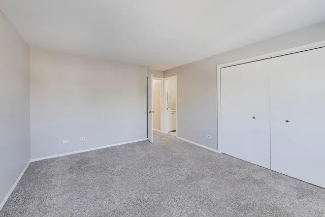 a white toilet sitting next to a white sink