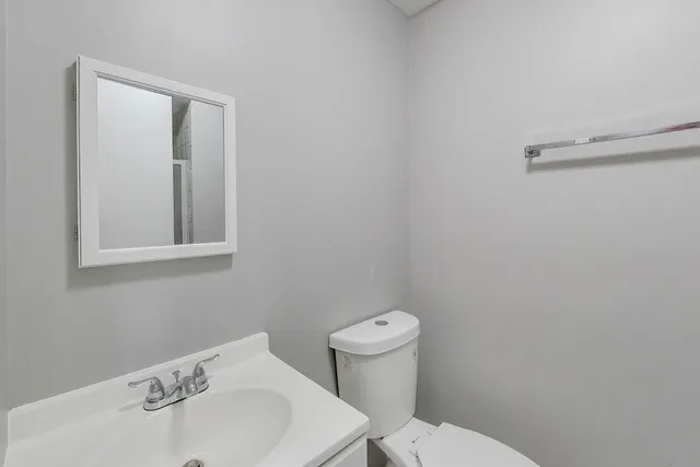 a bathroom with a glass shower door