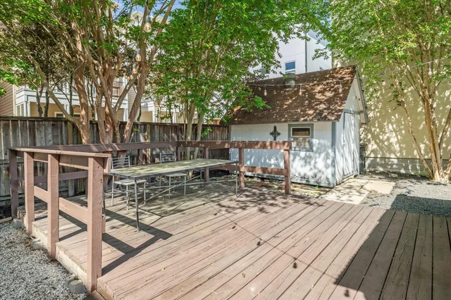 a view of house with wooden deck and living room