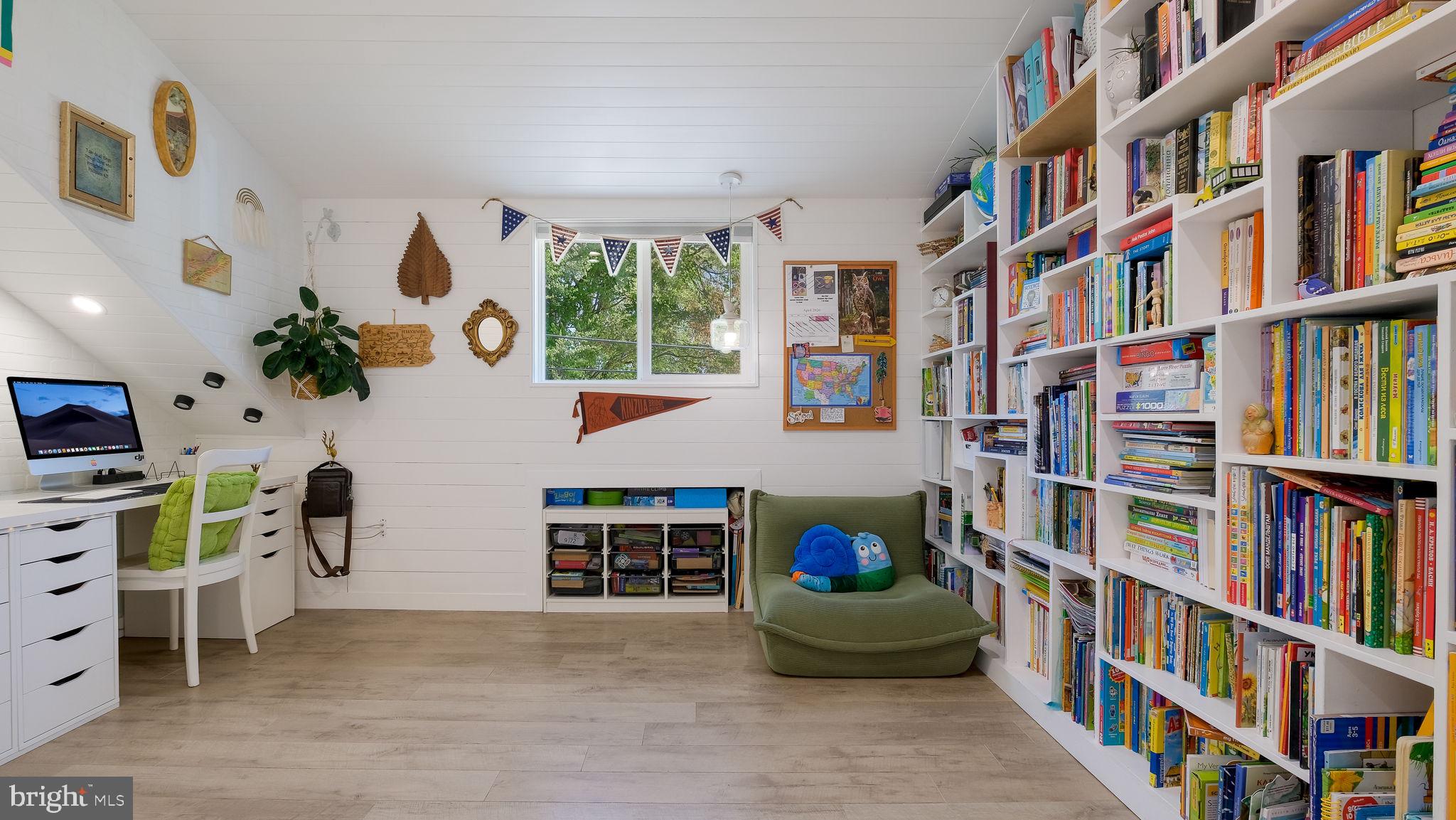 2308 3rd Marcus Hook, PA 19061 - Photo 11 of 37 a living room with furniture and a book shelf