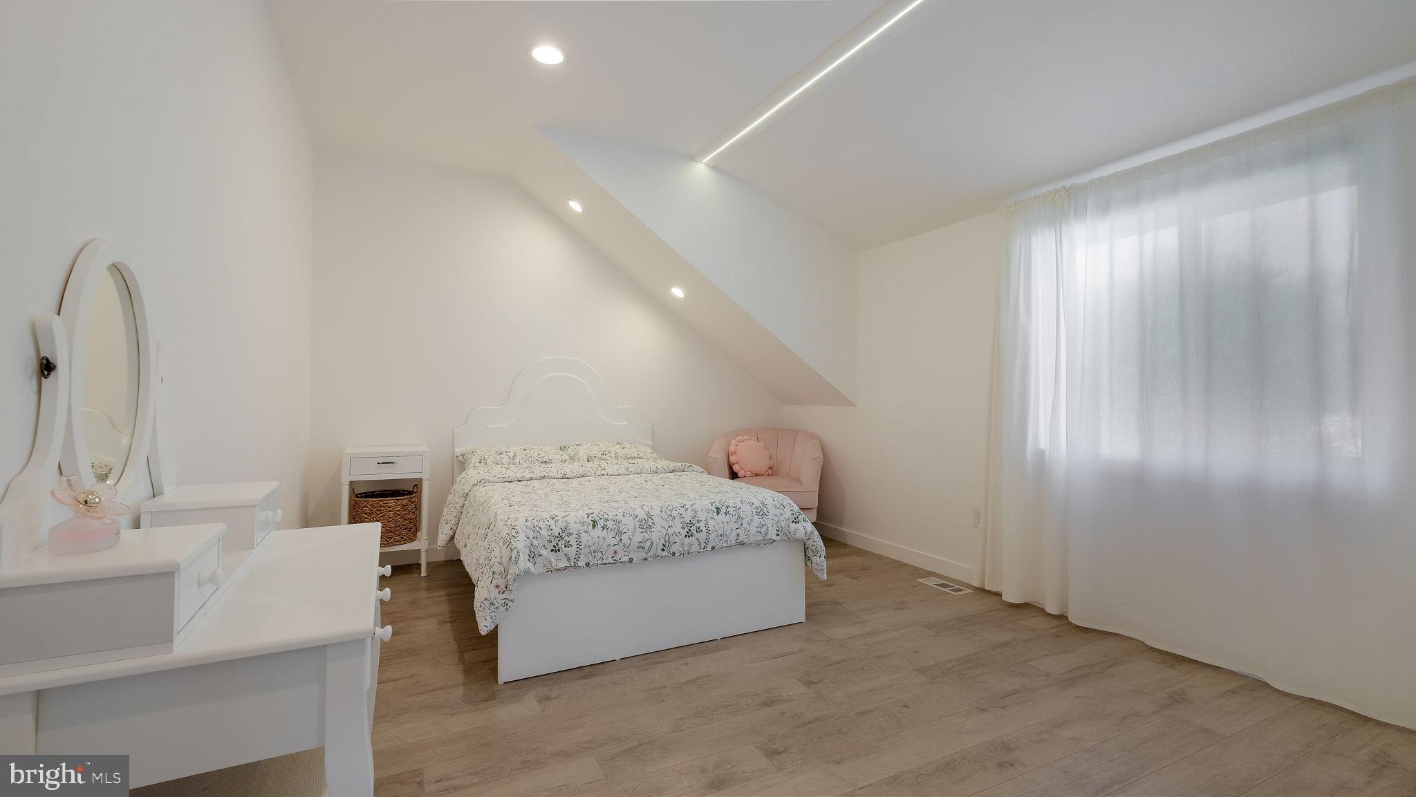 2308 3rd Marcus Hook, PA 19061 - Photo 15 of 37 a spacious bedroom with a bed and a sink