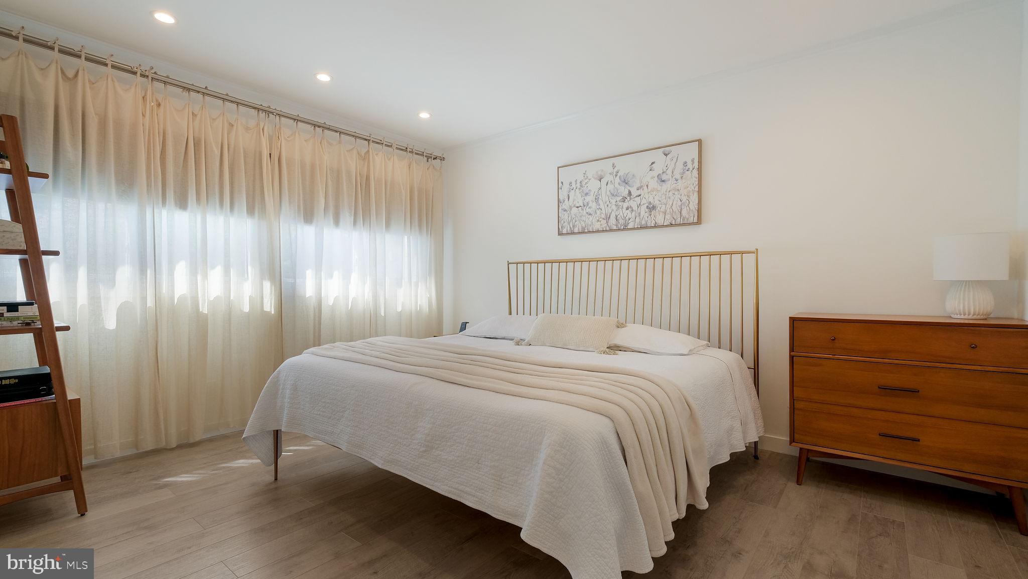 2308 3rd Marcus Hook, PA 19061 - Photo 19 of 37 a bedroom with a bed and a night stand