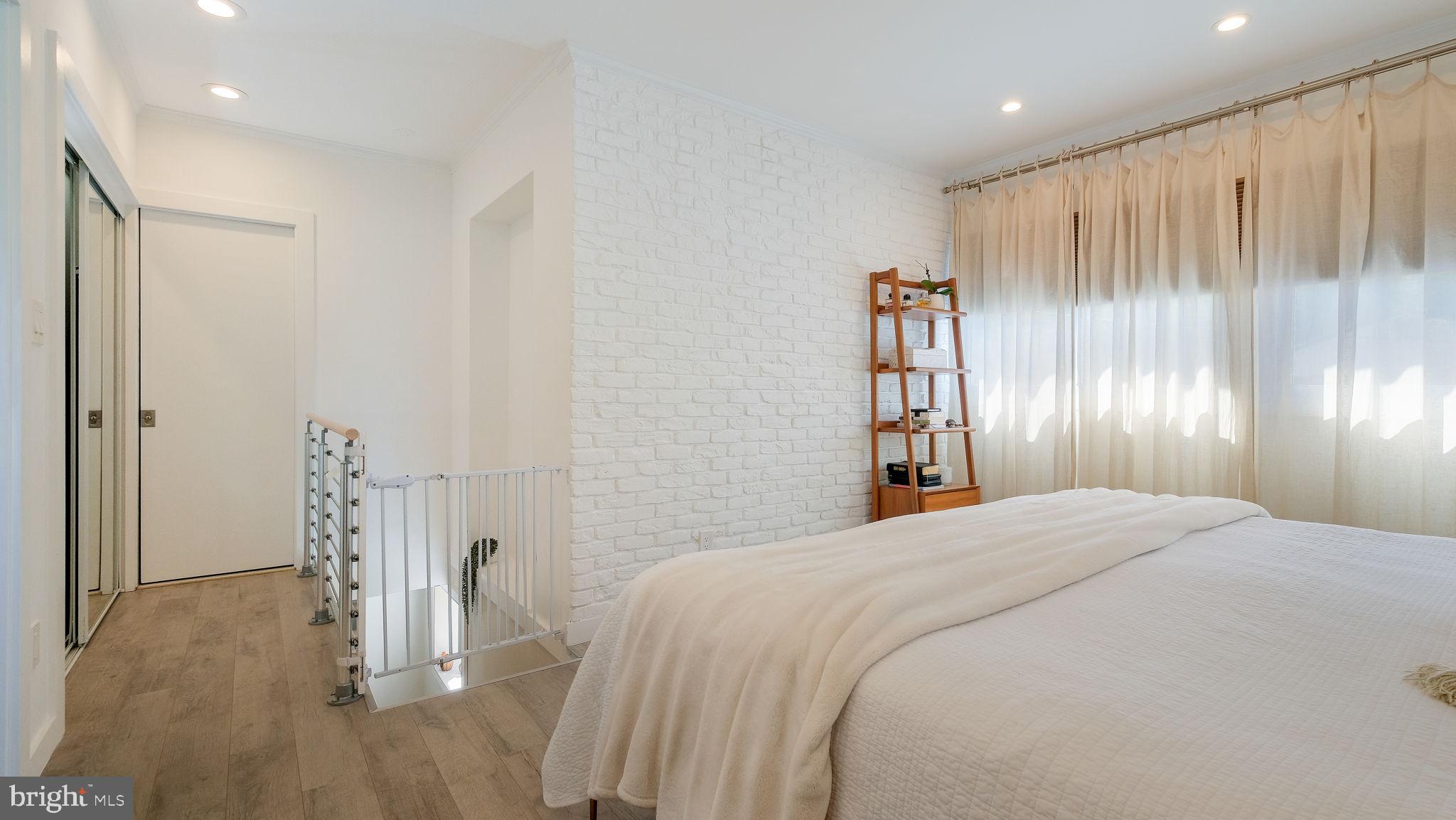 2308 3rd Marcus Hook, PA 19061 - Photo 20 of 37 a bedroom with a bed and a chandelier