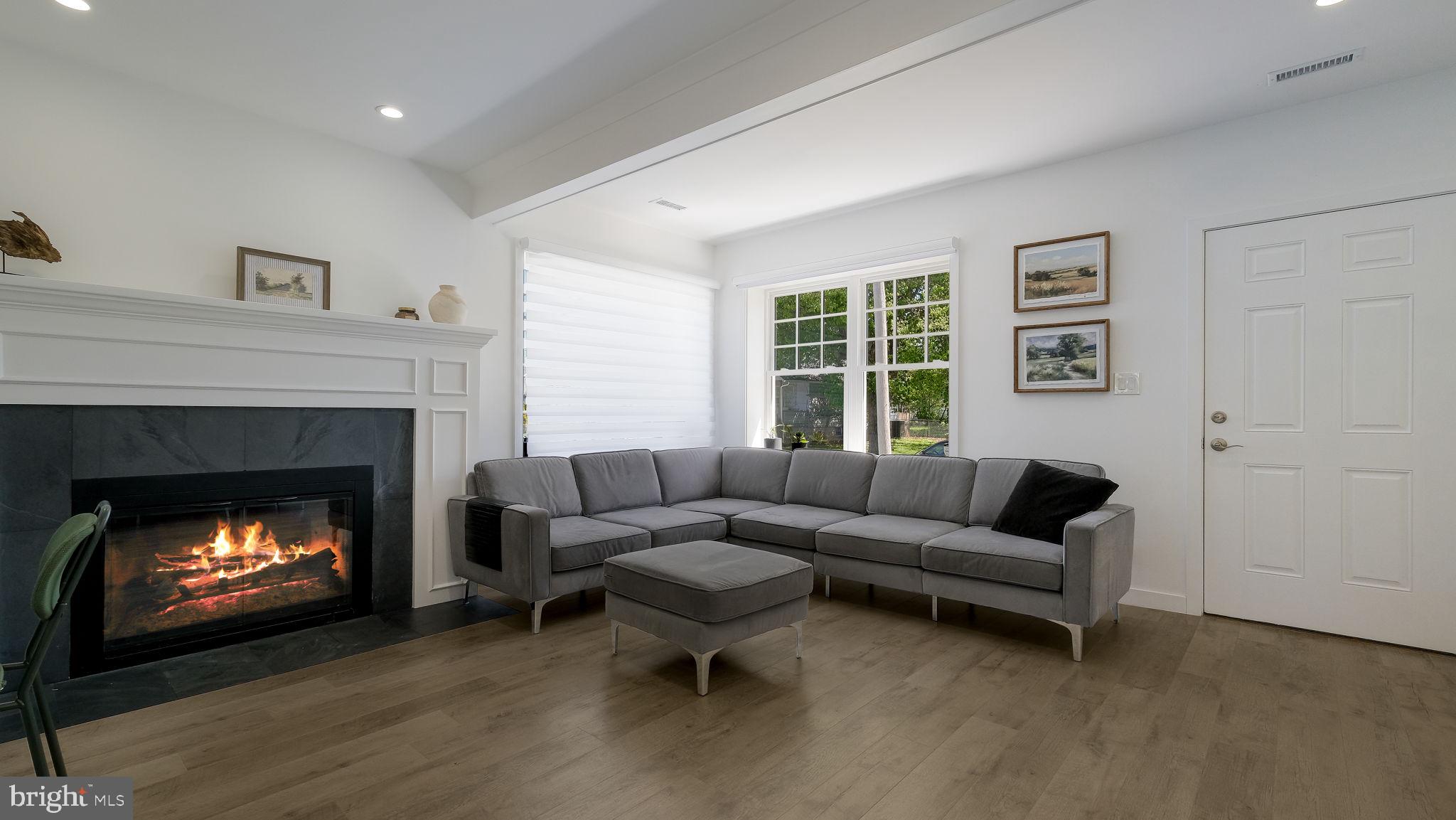 2308 3rd Marcus Hook, PA 19061 - Photo 3 of 37 a living room with furniture and a fireplace