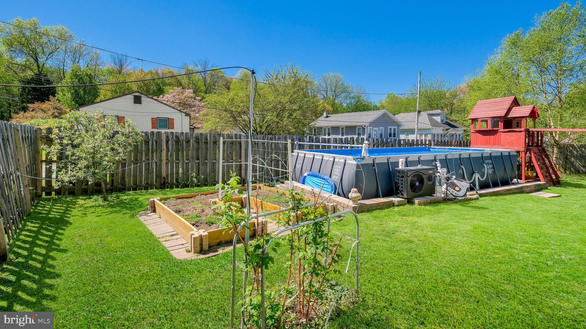 2308 3rd Marcus Hook, PA 19061 - Photo 31 of 37 a view of a backyard with plants and brick wall