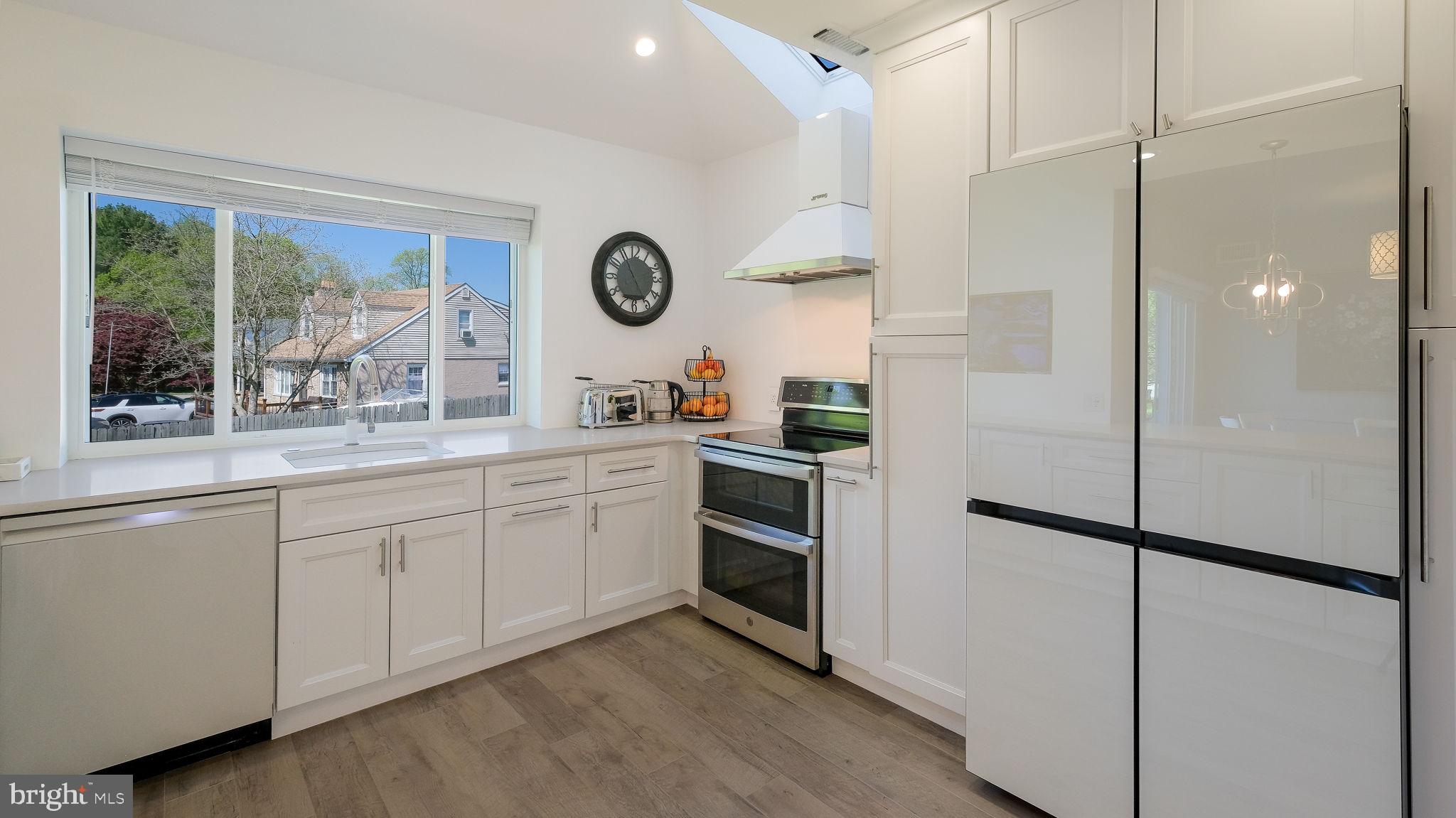 2308 3rd Marcus Hook, PA 19061 - Photo 10 of 37 a kitchen with a refrigerator and a sink