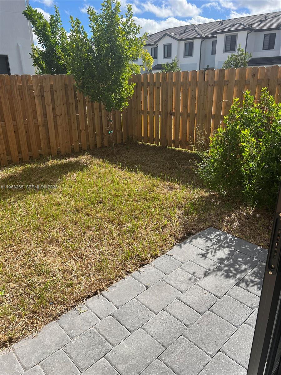 34531 Southwest 191st Avenue Homestead, FL 33030 - Photo 18 of 20 a view of a house with a wooden fence