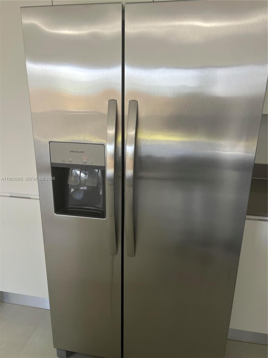 34531 Southwest 191st Avenue Homestead, FL 33030 - Photo 7 of 20 a close view of refrigerator in kitchen