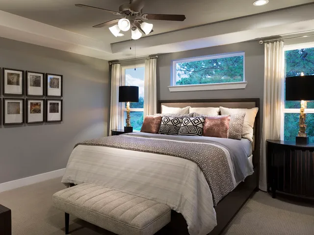 a bedroom with a large bed and a window