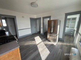 14 Guilfoile Street, Unit 2 Waterbury, CT 06708 - Photo 4 of 17 a kitchen with stainless steel appliances granite countertop a refrigerator and a sink