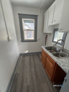 14 Guilfoile Street, Unit 2 Waterbury, CT 06708 - Photo 6 of 17 a kitchen with a sink stove and cabinets