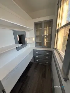 a bathroom with a bathtub and a window