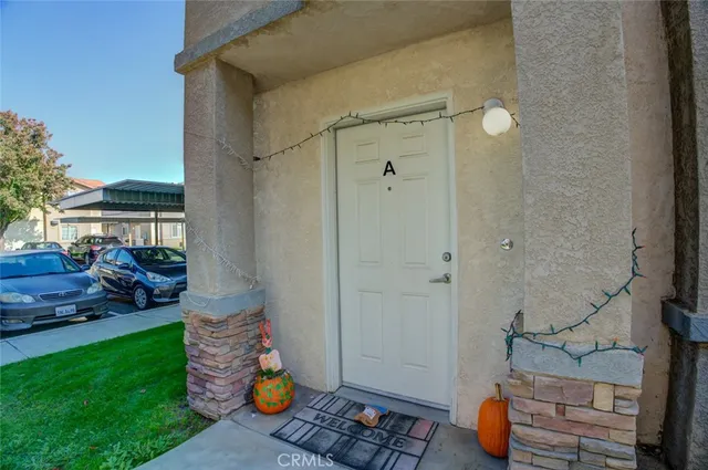 a view of a livingroom with furniture and stairs