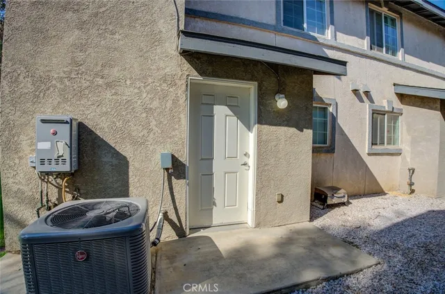 a view of a porch with table and chairs