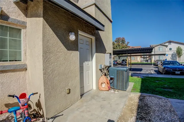 a view of a cars park in front of a building