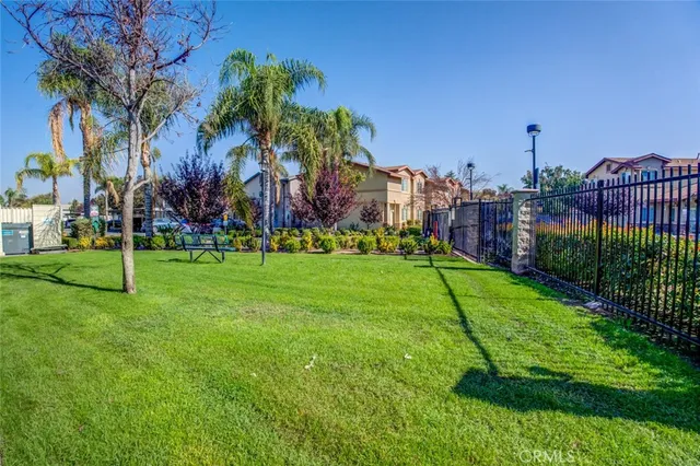 an aerial view of a residential apartment building with a yard