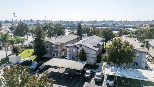 a aerial view of a house with a fountain