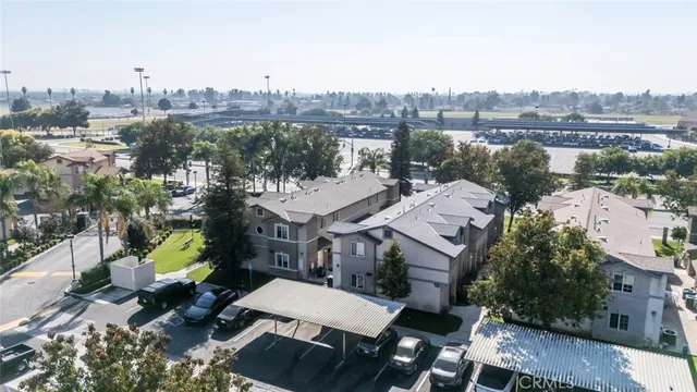 an aerial view of a residential houses with outdoor space