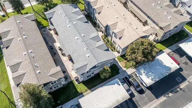 an aerial view of a residential apartment building with a city view