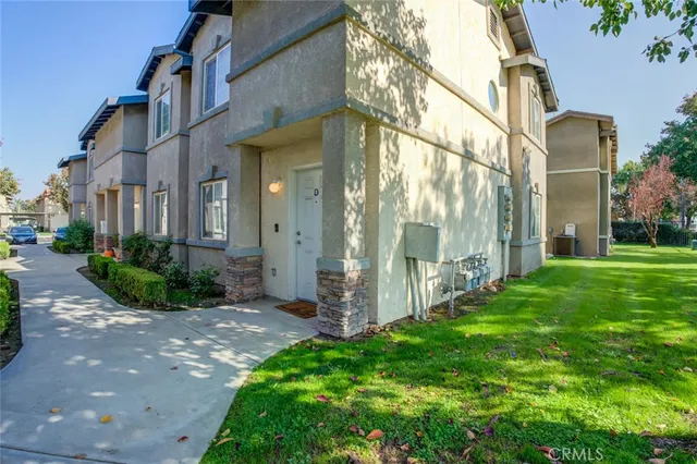 a view of a garden with brick walls