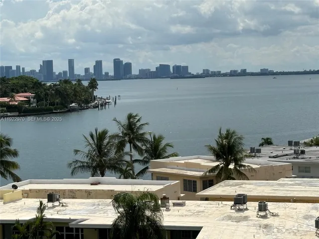 a view of a lake with a car parked