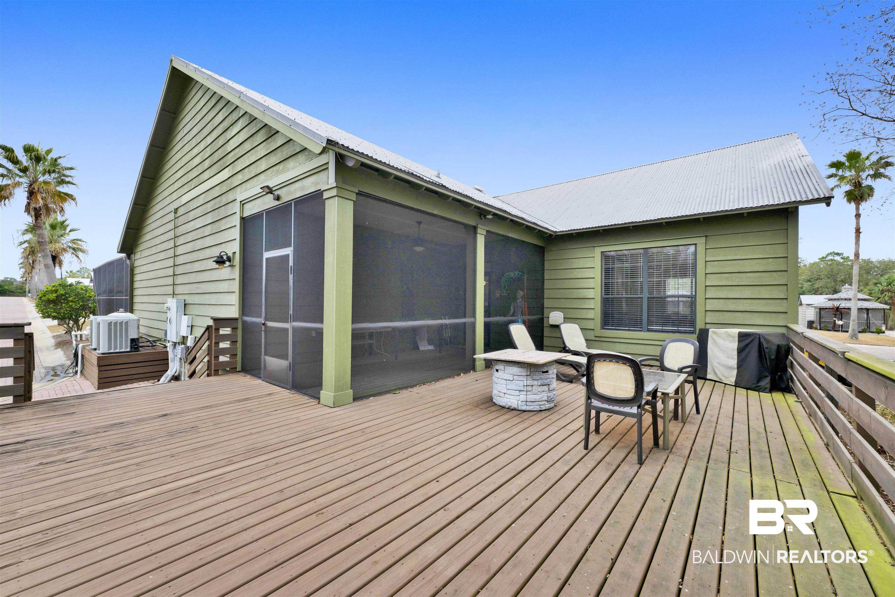 4650 Griffith Marina Road, Unit LOT 24 Orange Beach, AL 36561 - Photo 31 of 34 Deck featuring a sunroom and grilling area