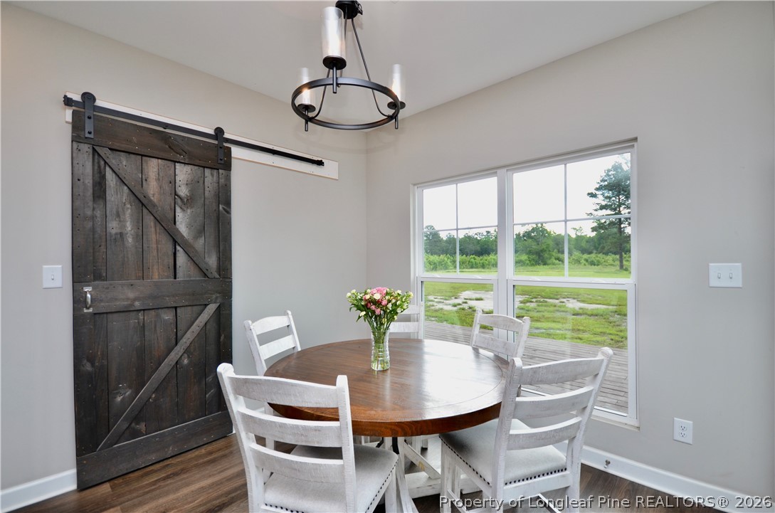 1865 John B Carter Road Fayetteville, NC 28312 - Photo 12 of 49 a view of a dining room with furniture window and wooden floor