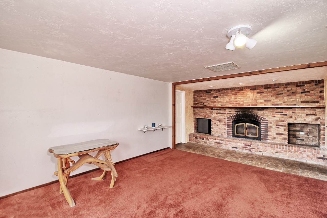 1066-19 19 1/2 Road Fruita, CO 81521 - Photo 38 of 42 a view of a livingroom with a fireplace and a fireplace
