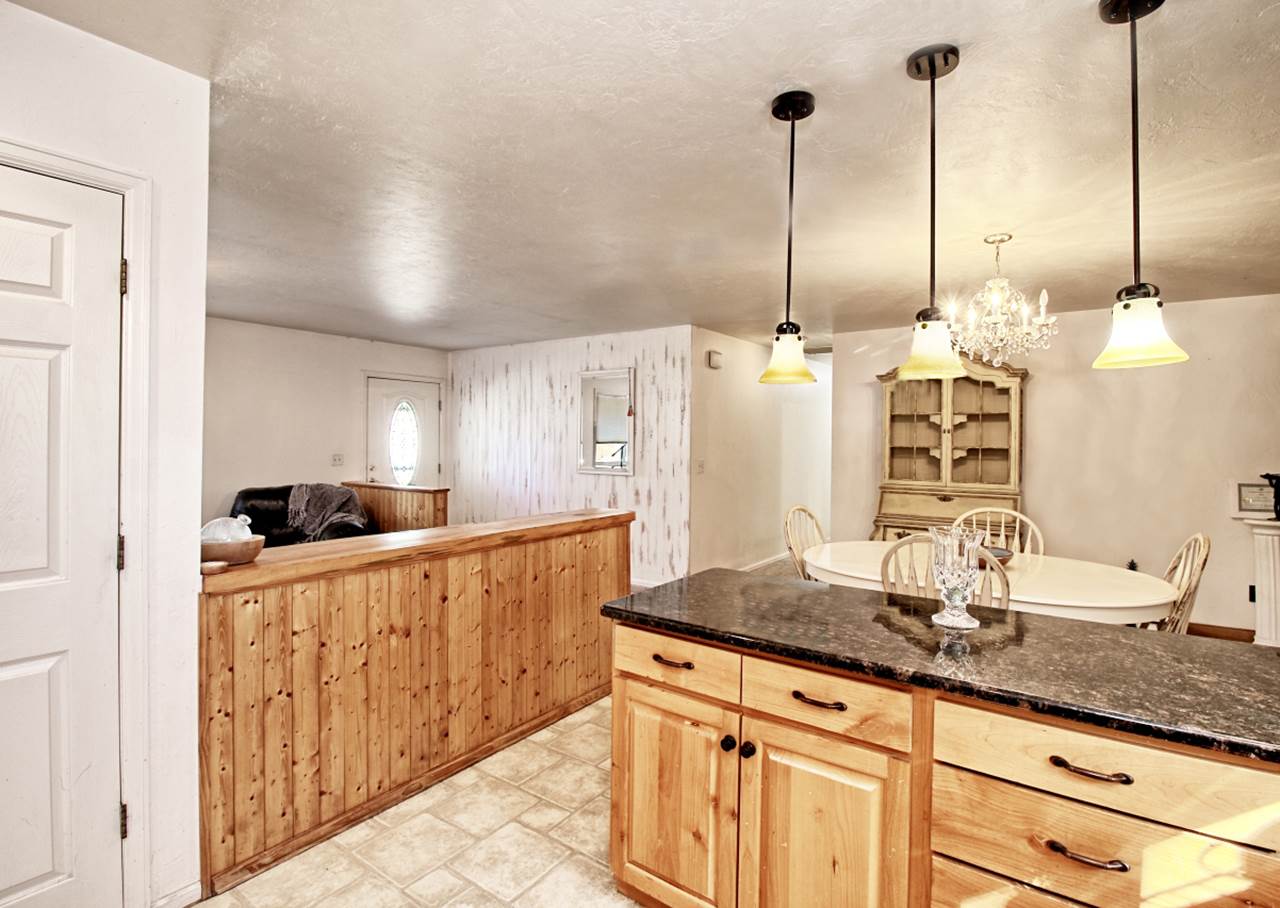 1066-19 19 1/2 Road Fruita, CO 81521 - Photo 9 of 42 a kitchen with stainless steel appliances granite countertop a sink a counter top space and cabinets