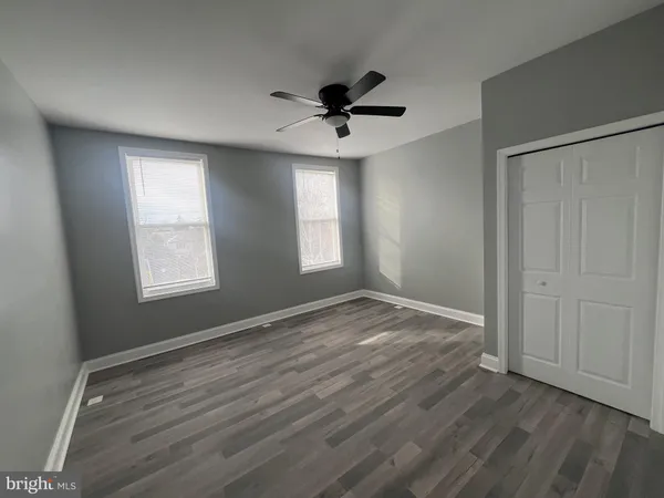 a view of an empty room and wooden floor