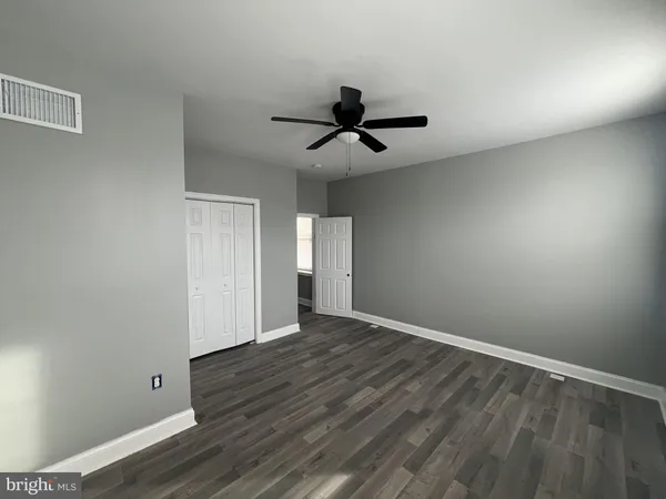 a view of a livingroom with furniture and wooden floor