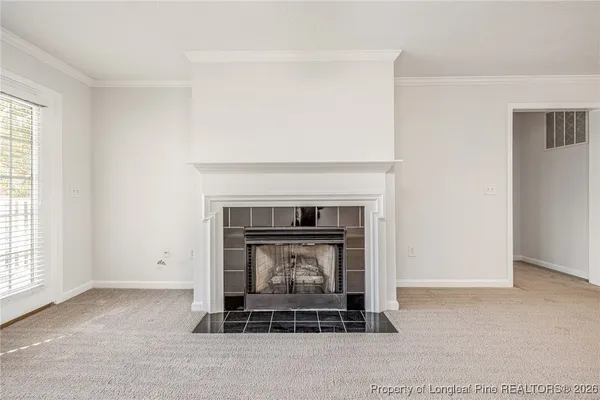 a living room with a fireplace