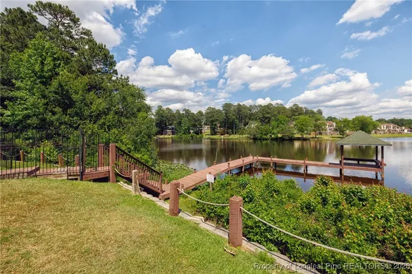 a view of a lake with a house in the background