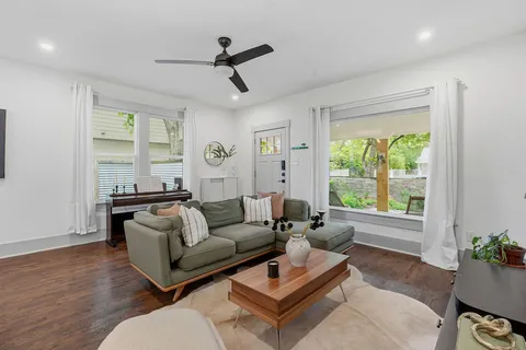 a living room with furniture and a large window