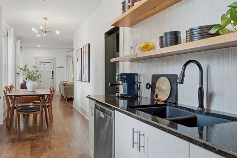 a kitchen with a sink and appliances