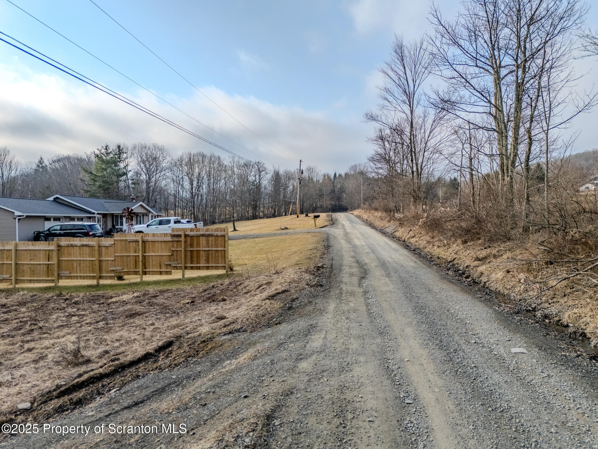 238 Blake Road Friendsville, PA 18818 - Photo 22 of 22 a view of a dry yard with wooden fence