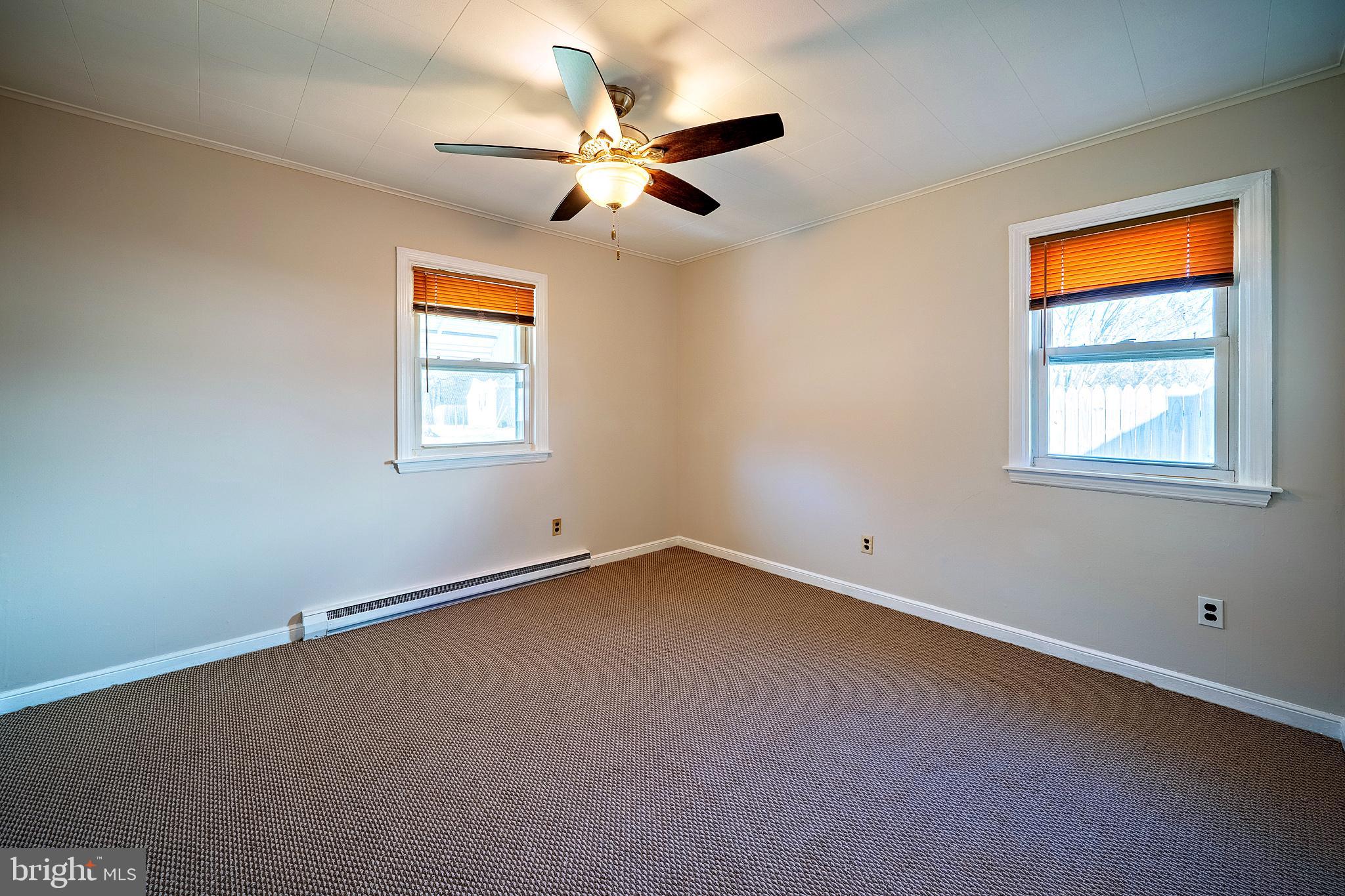 321 Wynnewood Road Ewing, NJ 08628 - Photo 17 of 31 an empty room with windows and fan