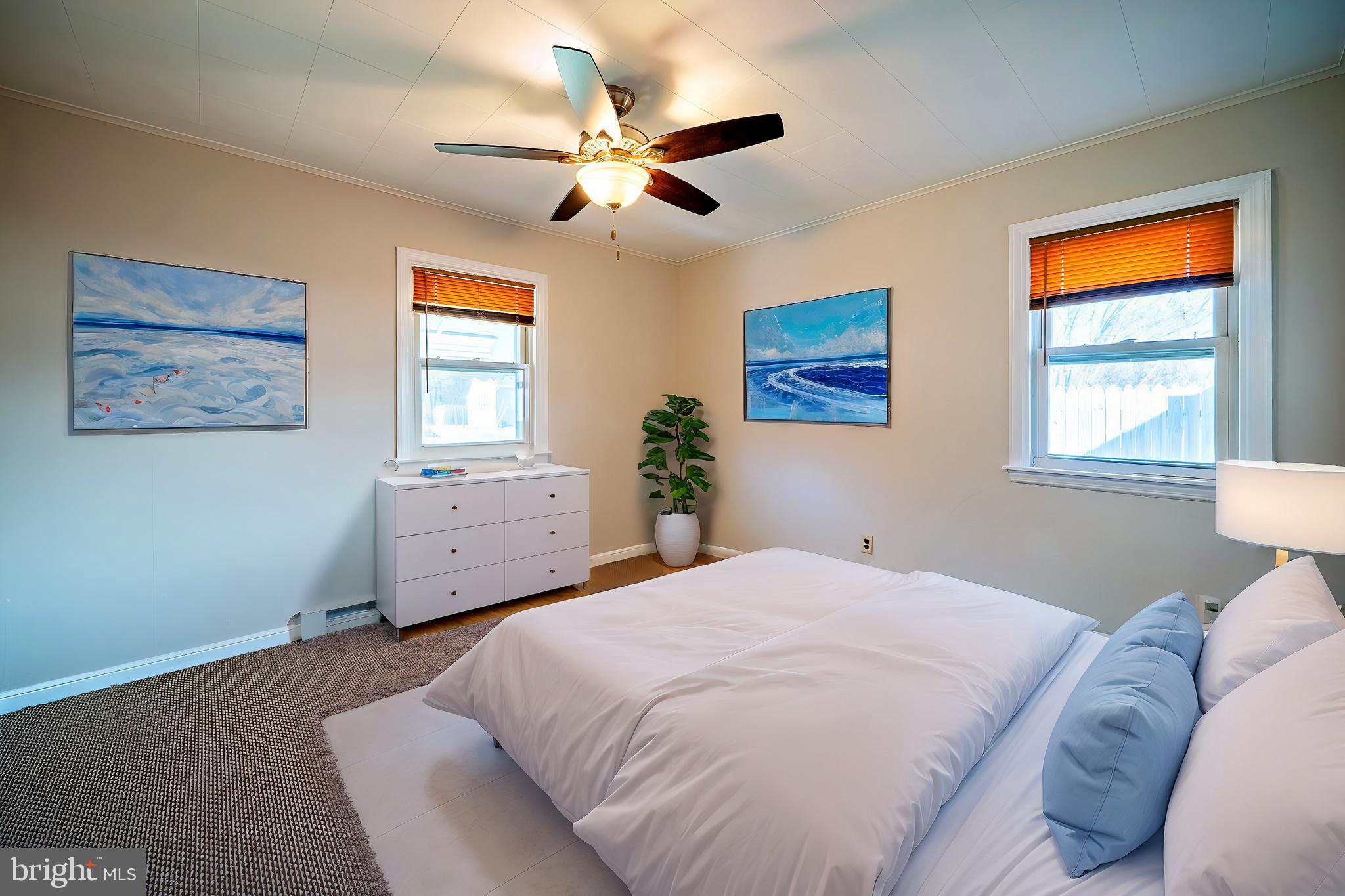 321 Wynnewood Road Ewing, NJ 08628 - Photo 18 of 31 a bedroom with a large bed and a window