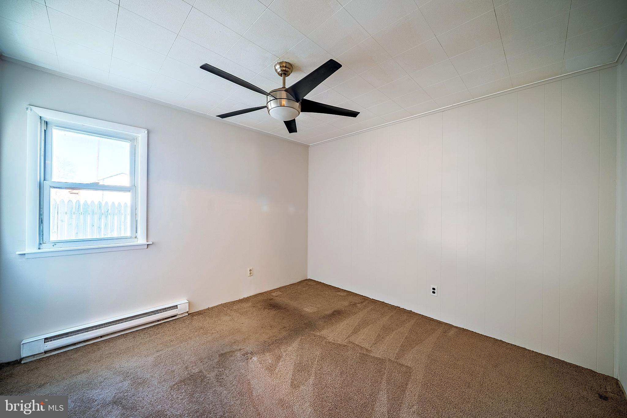 321 Wynnewood Road Ewing, NJ 08628 - Photo 20 of 31 an empty room with a window and a fan