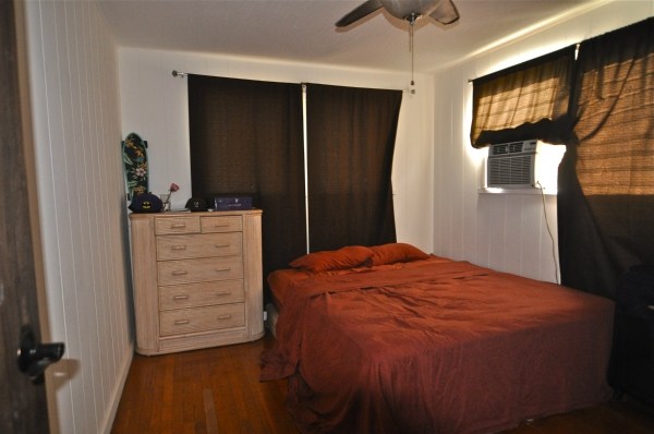 8630 Elepaio Road Kekaha, HI 96752 - Photo 18 of 20 a bedroom with a bed and a dresser