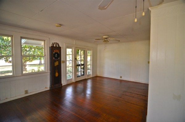 8630 Elepaio Road Kekaha, HI 96752 - Photo 5 of 20 an empty room with wooden floor and windows