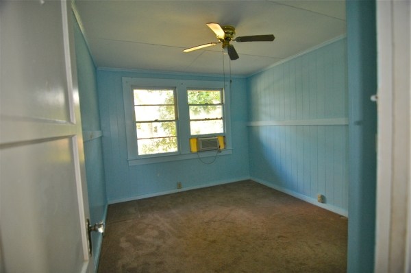 8630 Elepaio Road Kekaha, HI 96752 - Photo 7 of 20 an empty room with a window and a fan