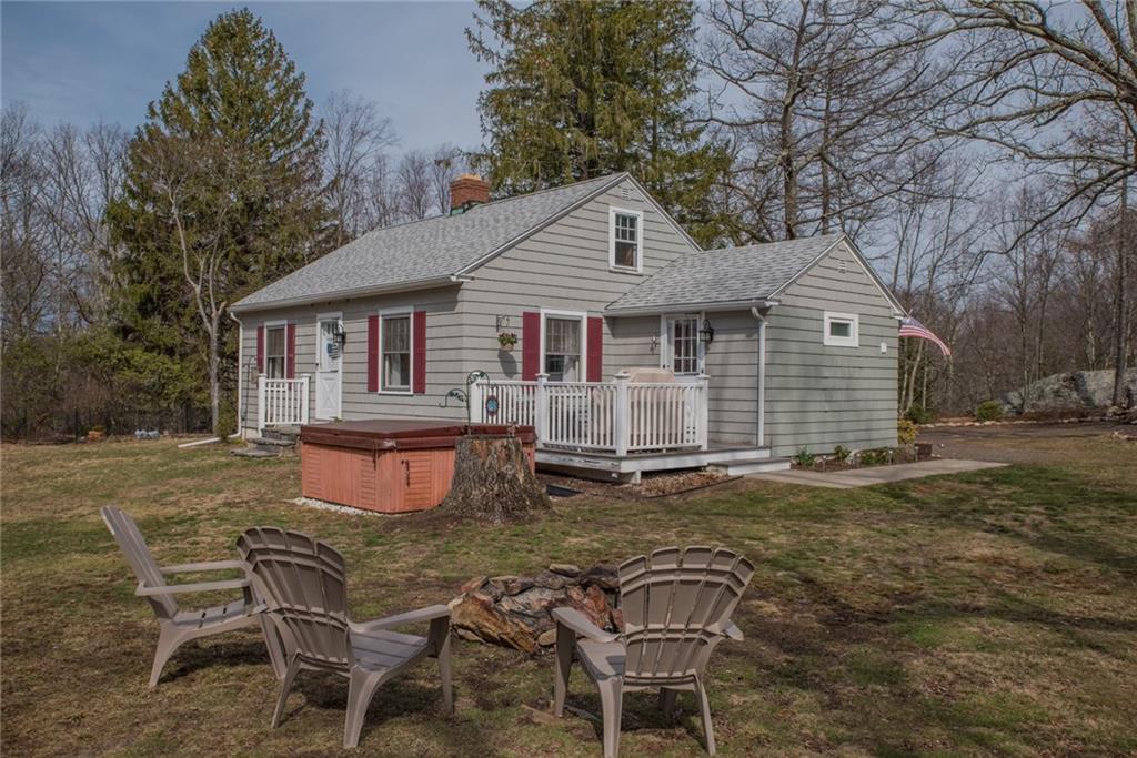 404 Wiese Albert Road Haddam, CT 06441 - Photo 1 of 1 a backyard of a house with barbeque oven and outdoor seating