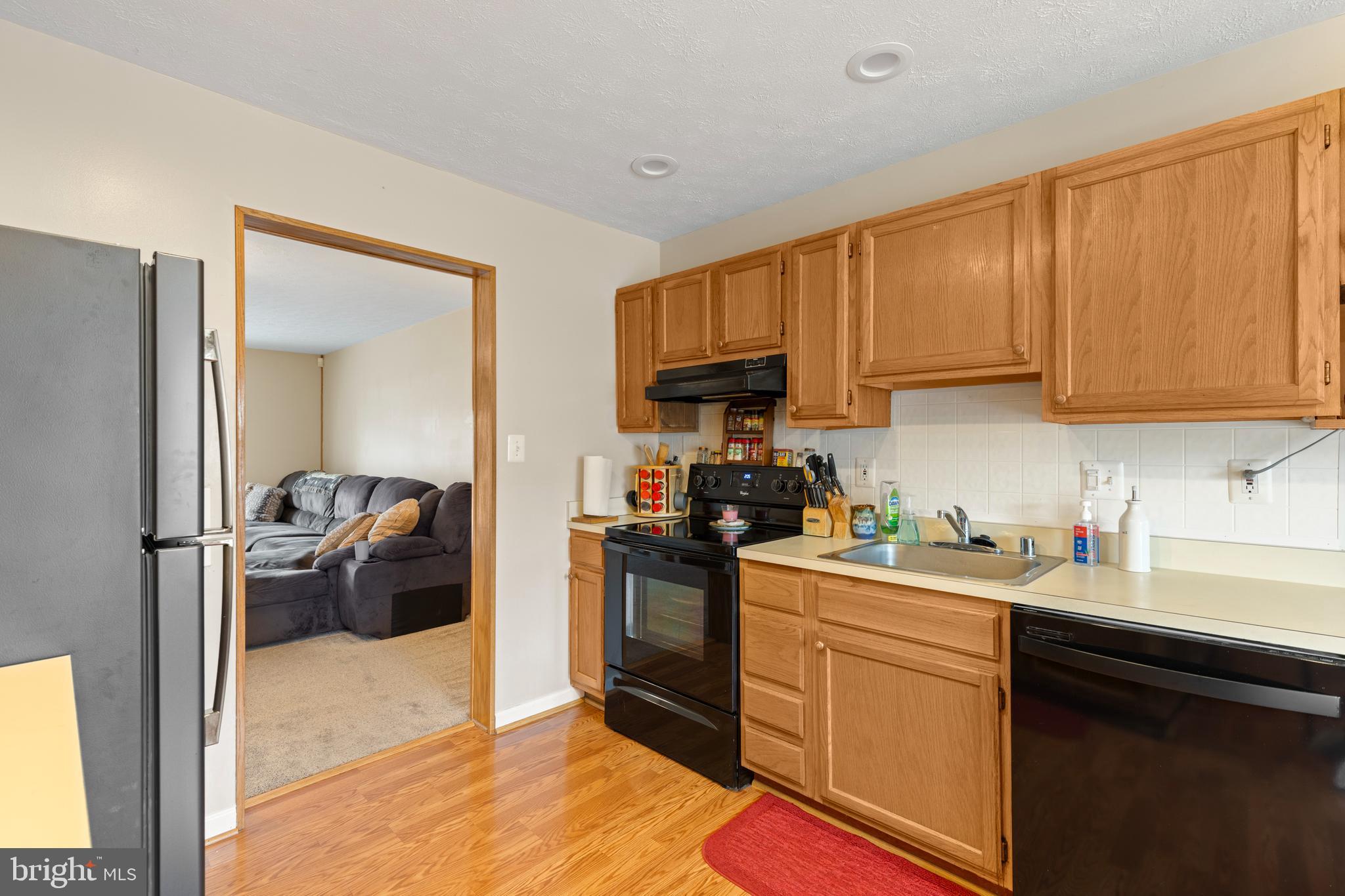 3916 Hunt Harbor Road Baltimore, MD 21220 - Photo 8 of 30 a kitchen with a sink cabinets and appliances