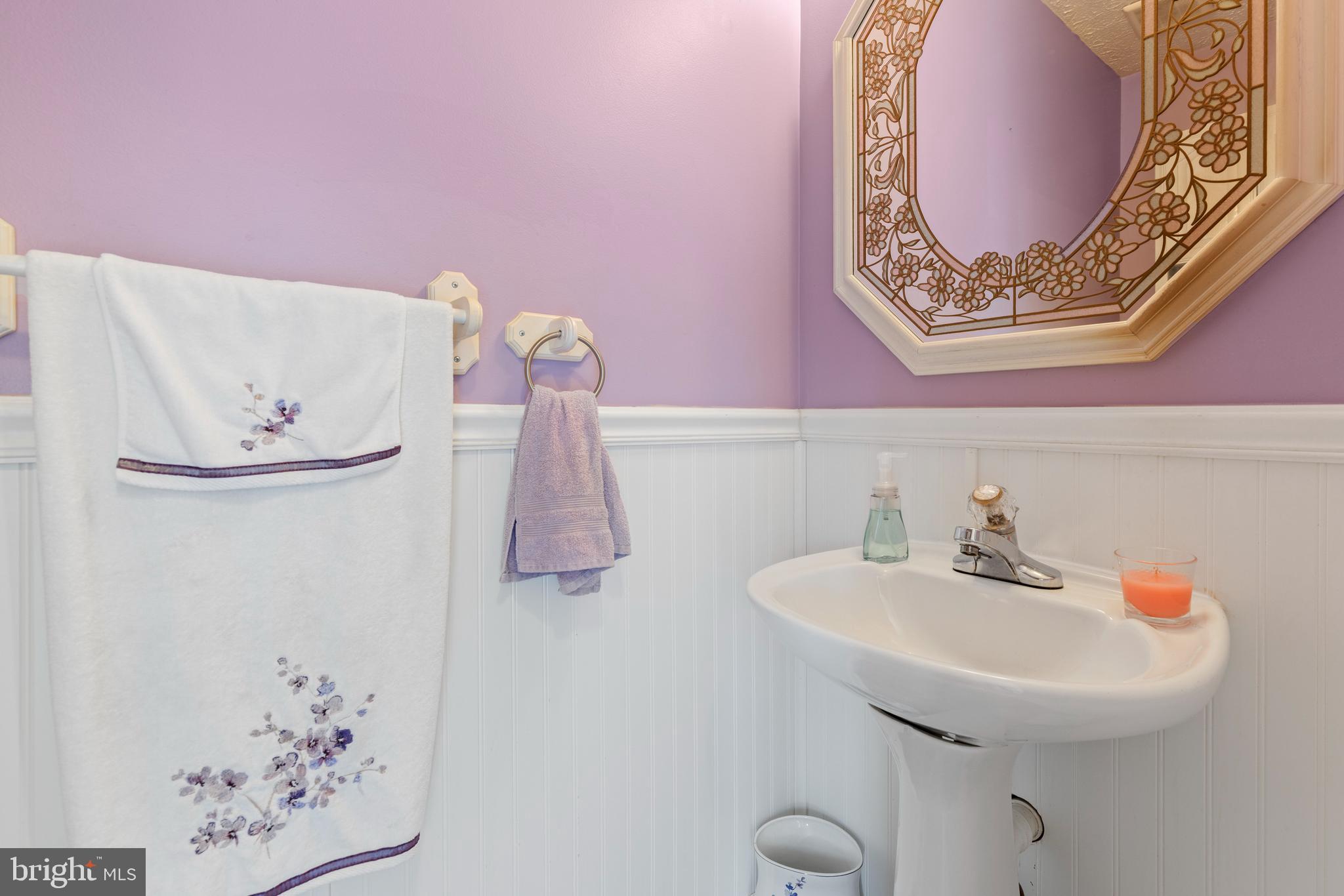 3916 Hunt Harbor Road Baltimore, MD 21220 - Photo 9 of 30 a bathroom with a sink and a mirror