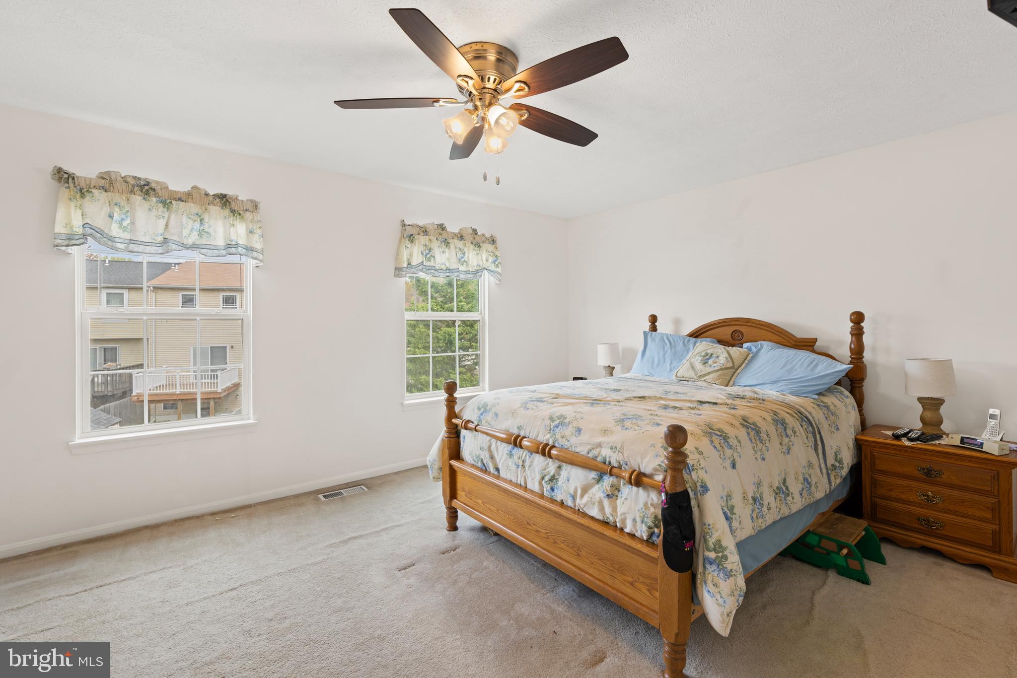 3916 Hunt Harbor Road Baltimore, MD 21220 - Photo 10 of 30 a bedroom with a bed and window