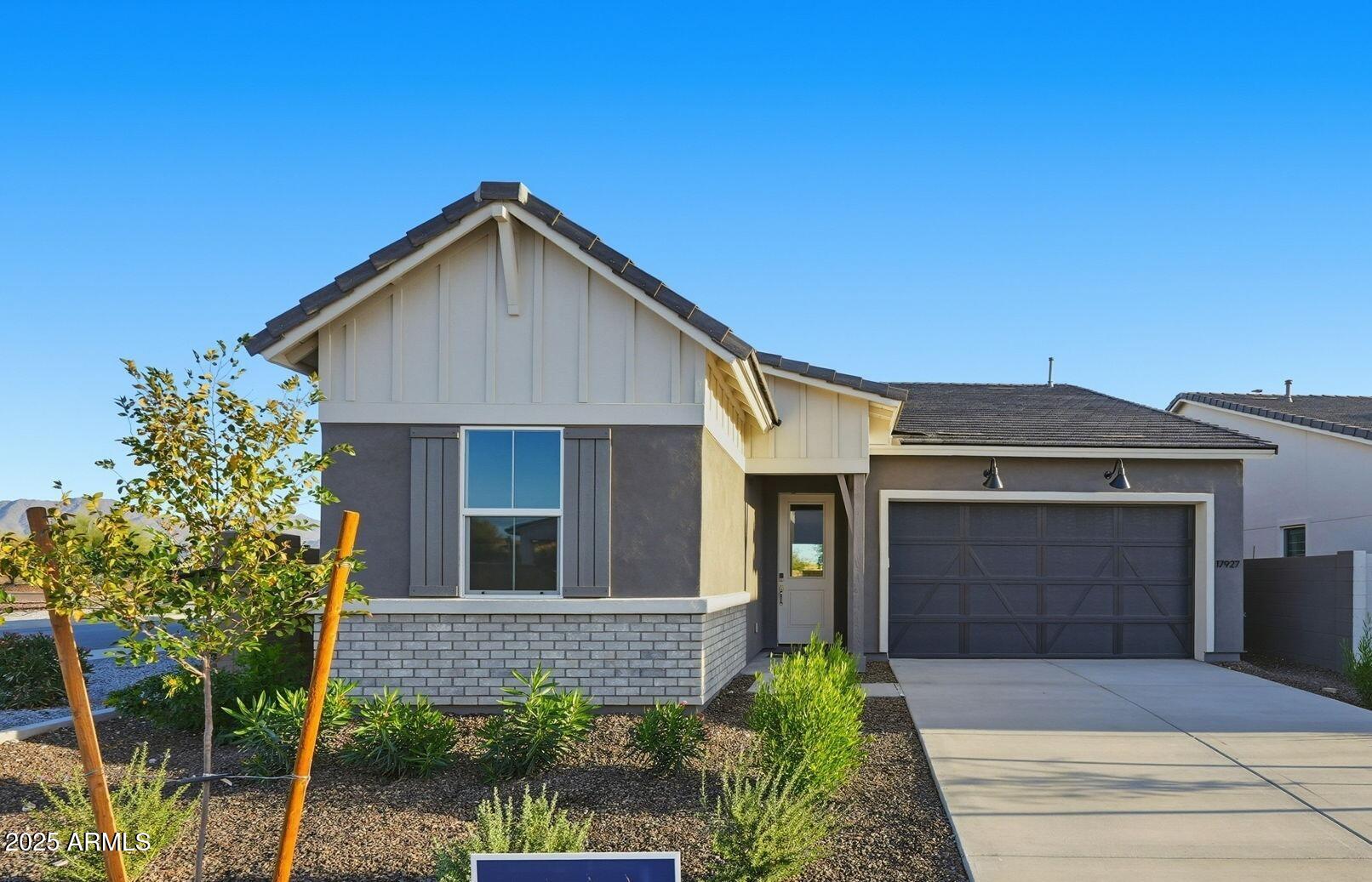 a front view of a house with yard