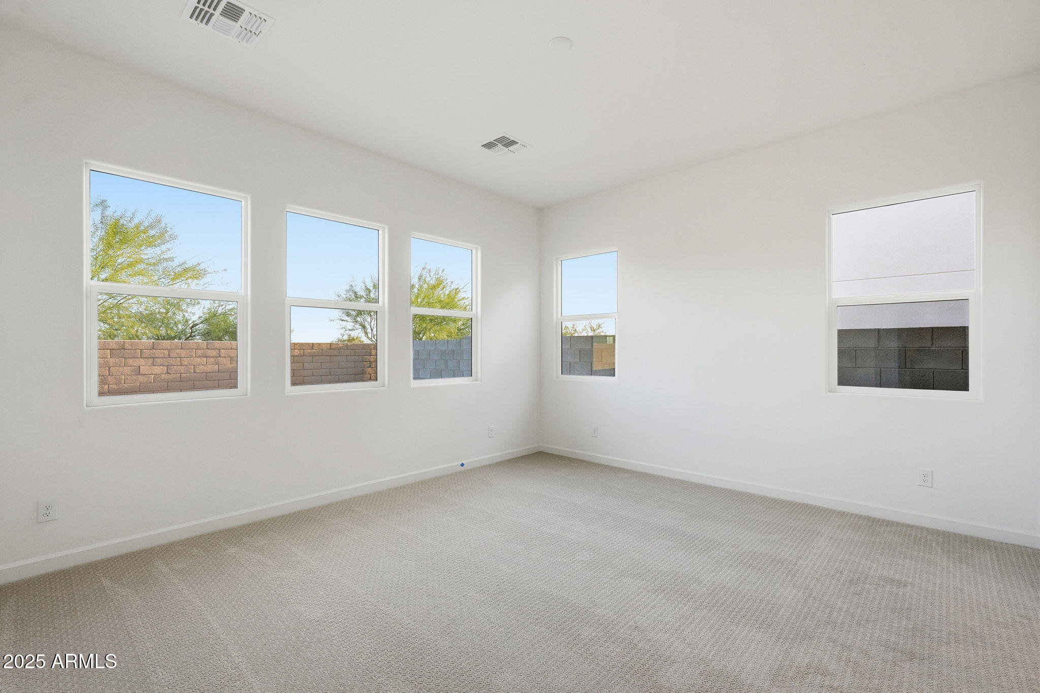 17927 West Long Lake Road Goodyear, AZ 85338 - Photo 12 of 36 an empty room with windows