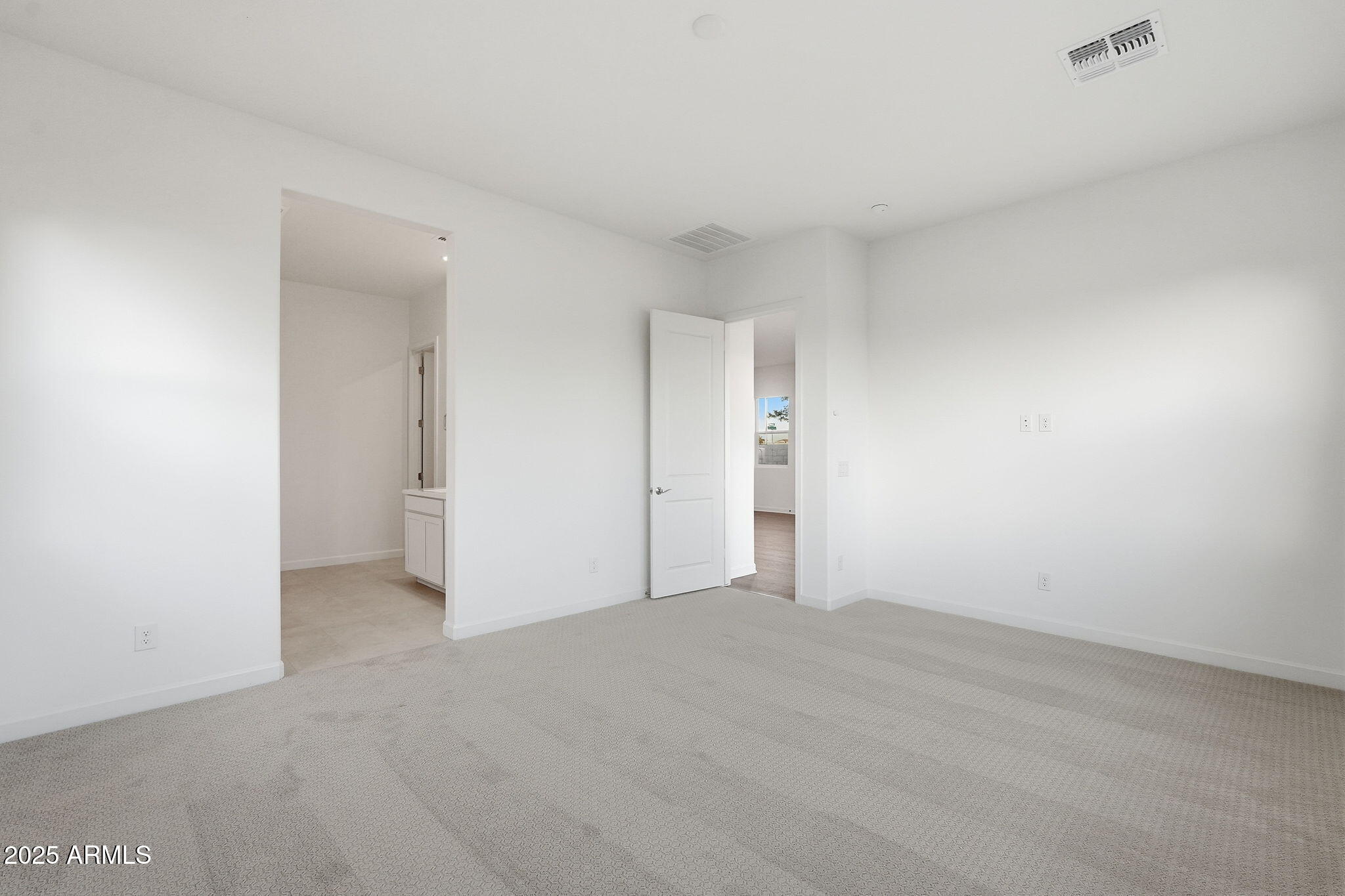 17927 West Long Lake Road Goodyear, AZ 85338 - Photo 13 of 36 a view of an empty room and closet