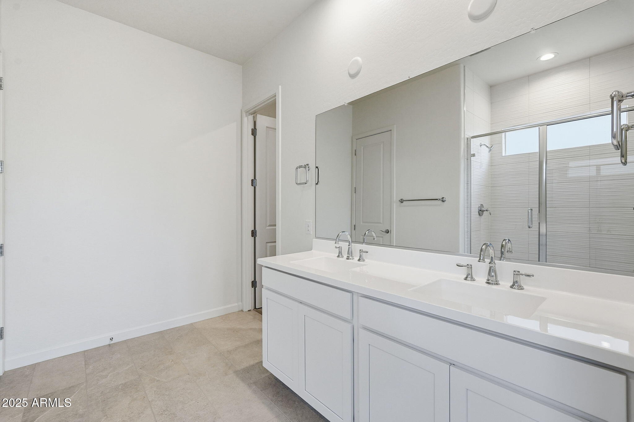 17927 West Long Lake Road Goodyear, AZ 85338 - Photo 14 of 36 a bathroom with a sink and a mirror